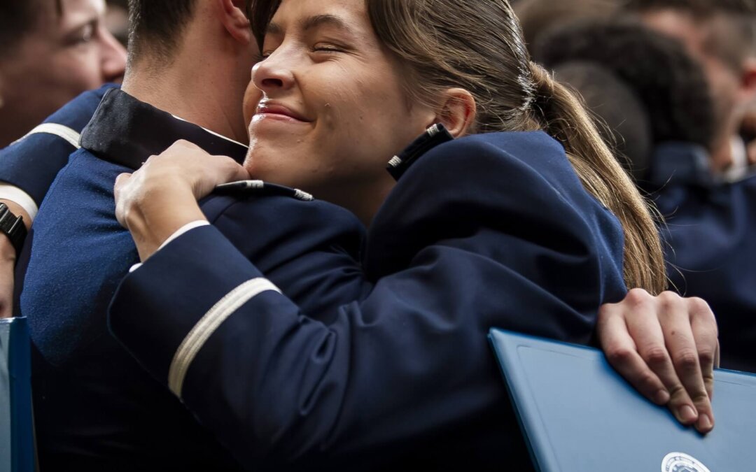 Graduates Hugging