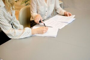 Two women working on a document