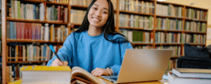female student studying in a library